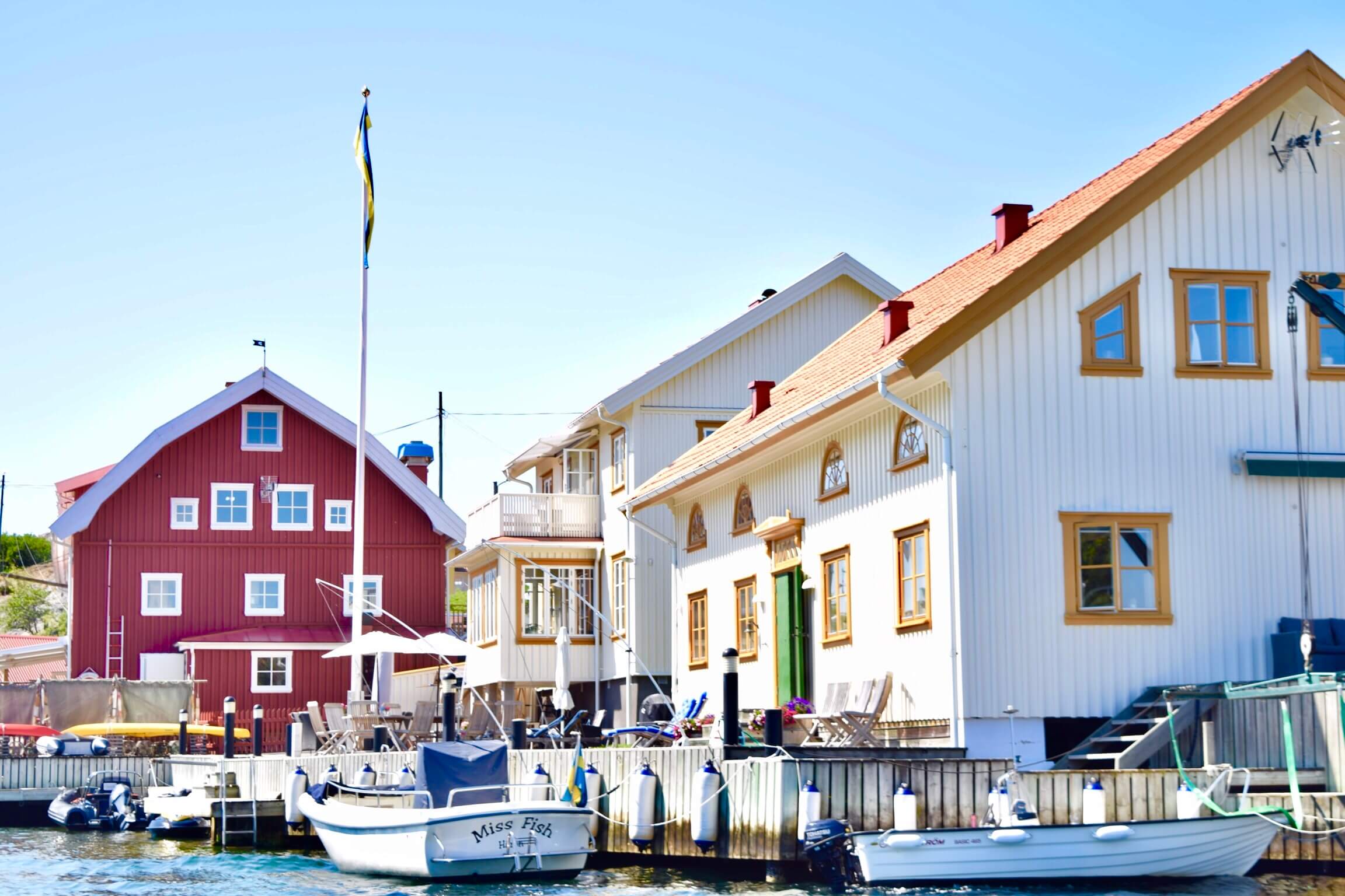 A small fishing pier with fishing boats on a dock.